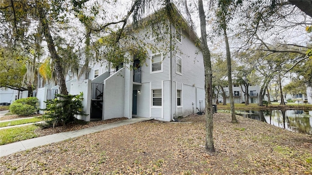 view of home's exterior featuring a water view