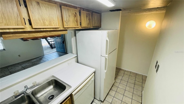 clothes washing area featuring sink and light tile patterned flooring