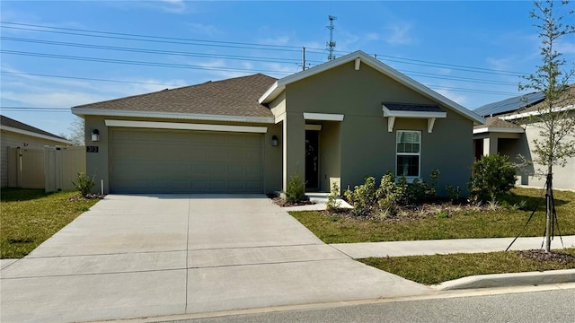 ranch-style home with a garage and a front yard