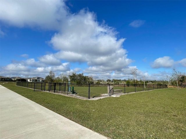 surrounding community with a yard and a rural view