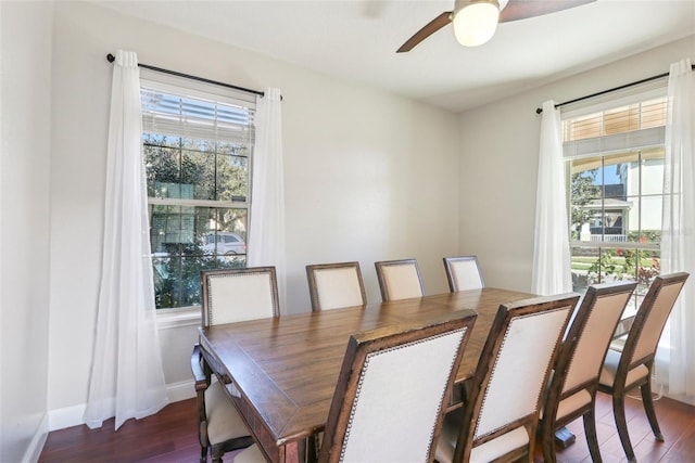 dining space with dark hardwood / wood-style floors and ceiling fan