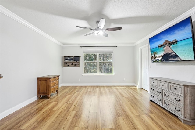 living room featuring crown molding, light hardwood / wood-style flooring, and a textured ceiling