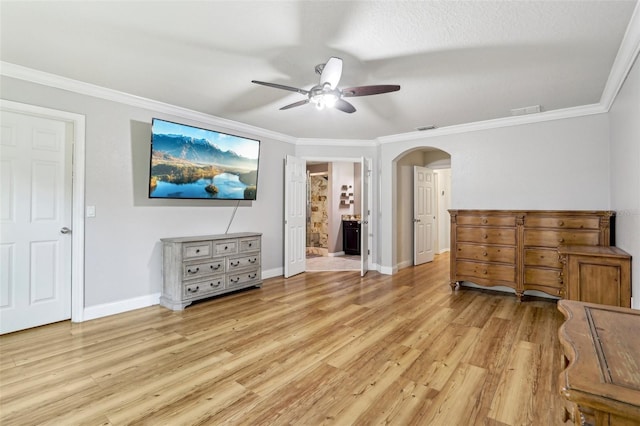 bedroom featuring ceiling fan, ensuite bath, ornamental molding, and light hardwood / wood-style floors