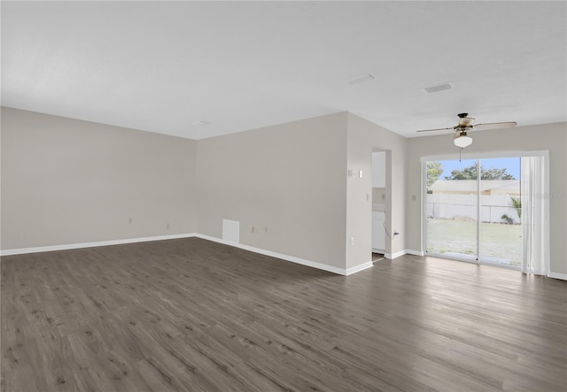 unfurnished living room featuring dark hardwood / wood-style floors and ceiling fan