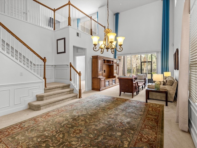 1431 Milledge Ln, Davenport, FL 33896 - interior space featuring an inviting chandelier, a towering ceiling, and light colored carpet