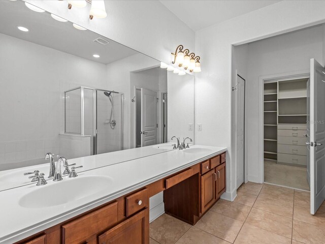 1431 Milledge Ln, Davenport, FL 33896 - bathroom with tile patterned flooring, vanity, and walk in shower