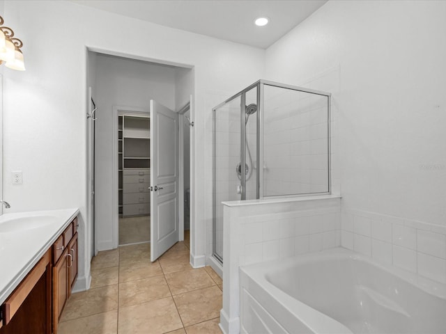 1431 Milledge Ln, Davenport, FL 33896 - bathroom with vanity, tile patterned floors, and plus walk in shower