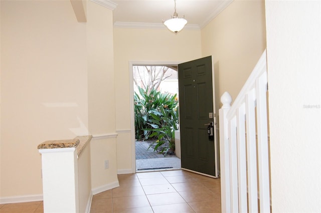 entryway featuring light tile patterned flooring and crown molding