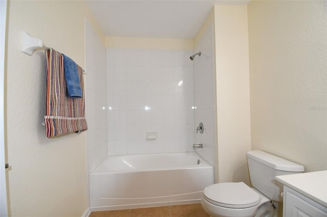 full bathroom featuring tile patterned floors, toilet, vanity, and tiled shower / bath