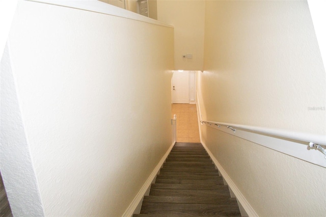 stairs featuring hardwood / wood-style flooring