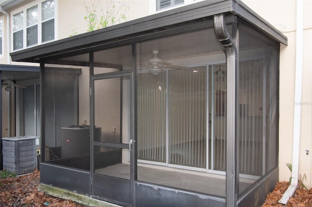 view of patio / terrace with cooling unit and a sunroom