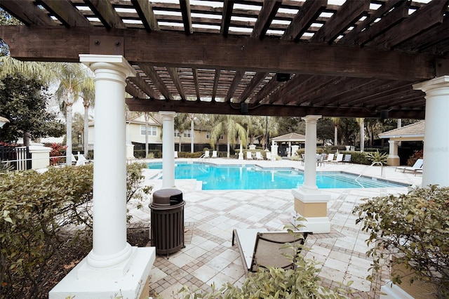 view of swimming pool featuring a patio and a pergola