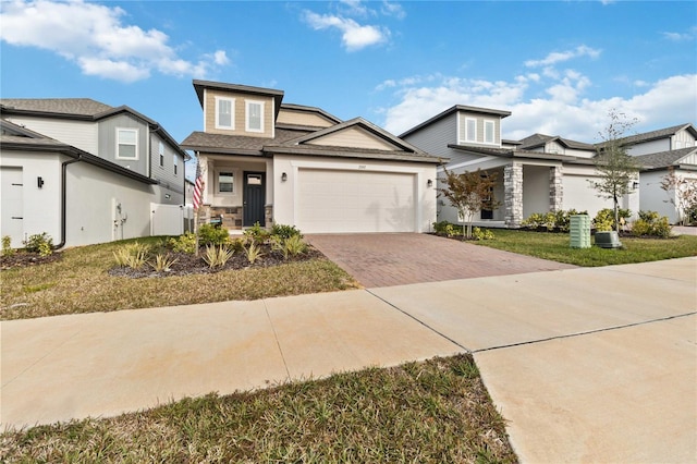 view of front of house with a garage and a front yard