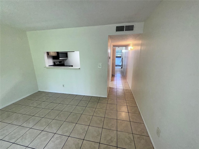 view of tiled spare room