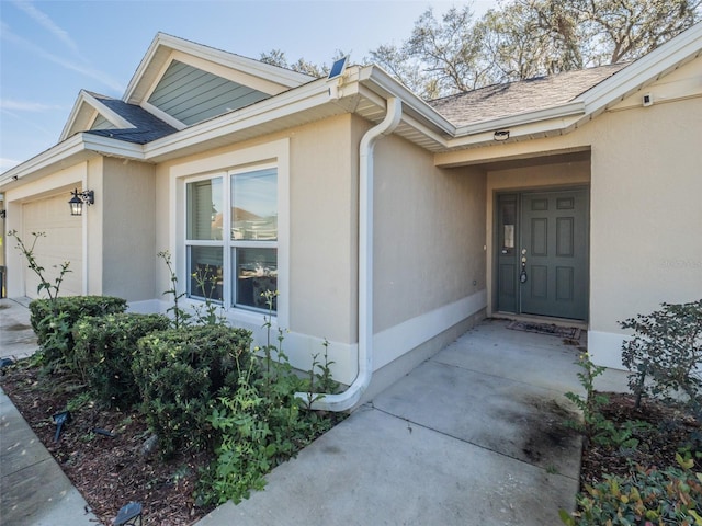 property entrance with a garage