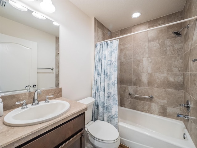 full bathroom featuring vanity, toilet, and shower / tub combo with curtain