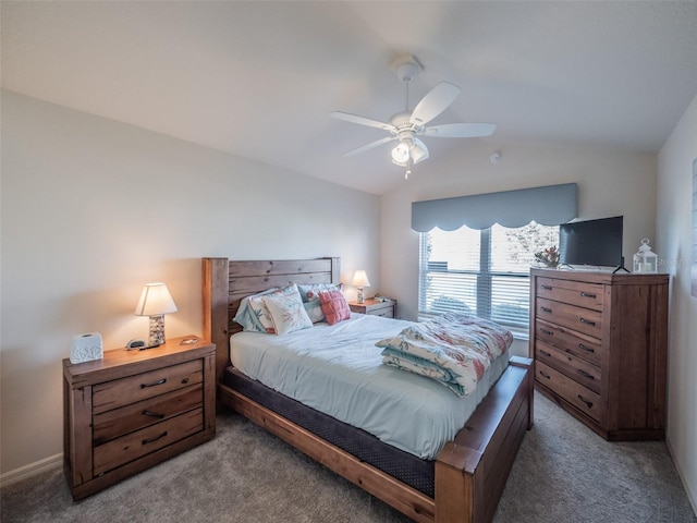 bedroom featuring ceiling fan, carpet floors, and vaulted ceiling