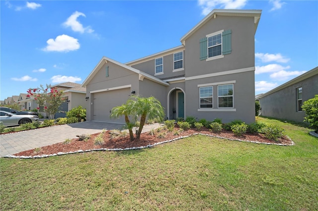 front facade with a garage and a front yard