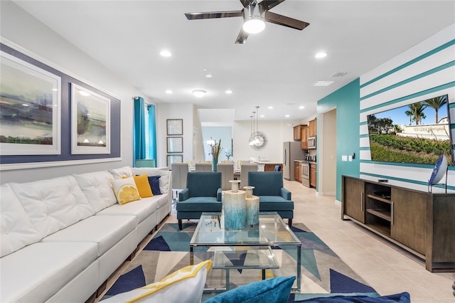 tiled living room with ceiling fan