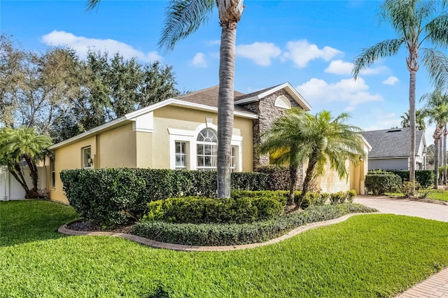 view of property exterior featuring a lawn