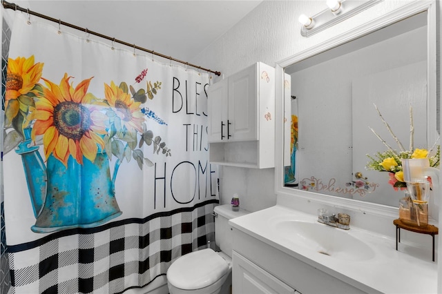 bathroom featuring vanity, a shower with curtain, and toilet