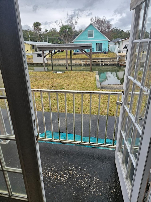 balcony featuring a water view