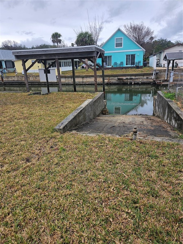 view of yard featuring a dock