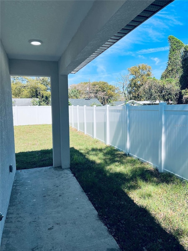 view of yard with a patio area and a fenced backyard