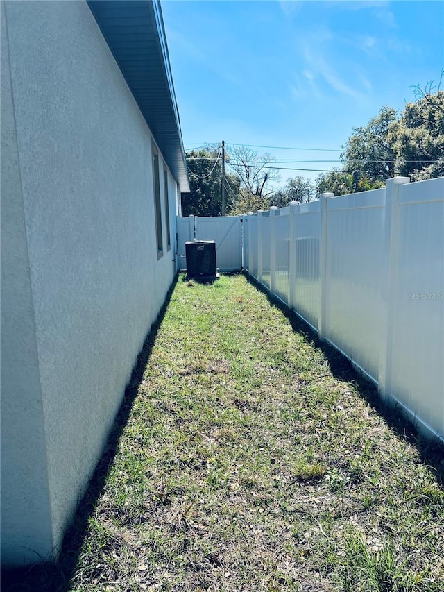 view of yard with a fenced backyard