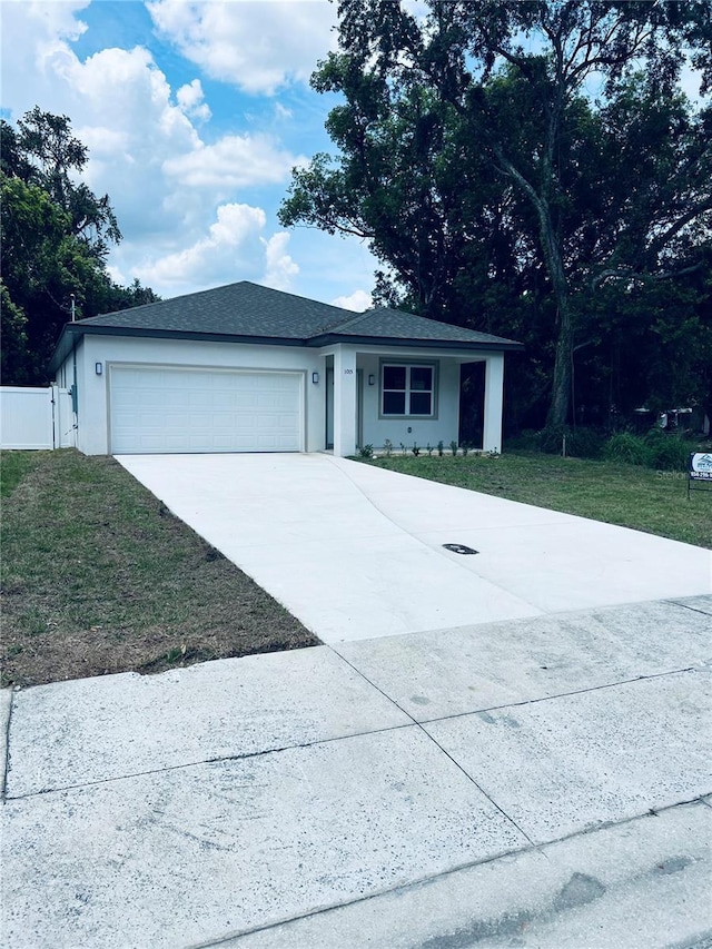 1015 25th St, Orlando, FL 32805 - single story home with a garage, concrete driveway, and stucco siding