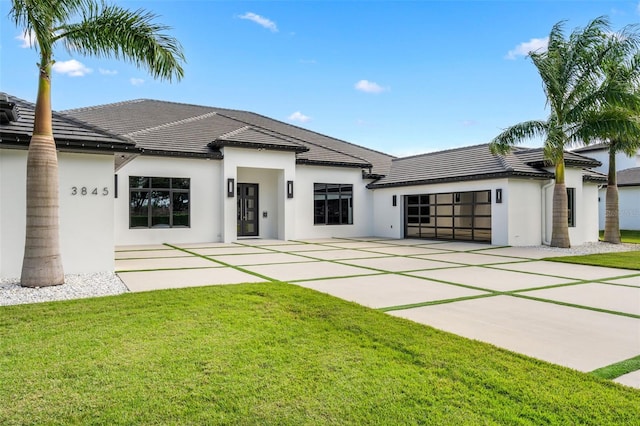 view of front of property with a patio area and a front yard