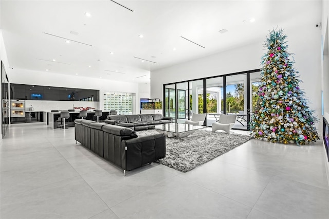 living room with a high ceiling