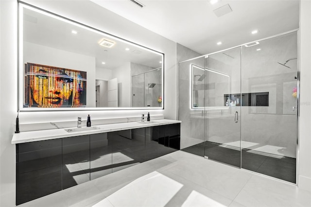 bathroom featuring vanity, tile patterned floors, and a shower with shower door