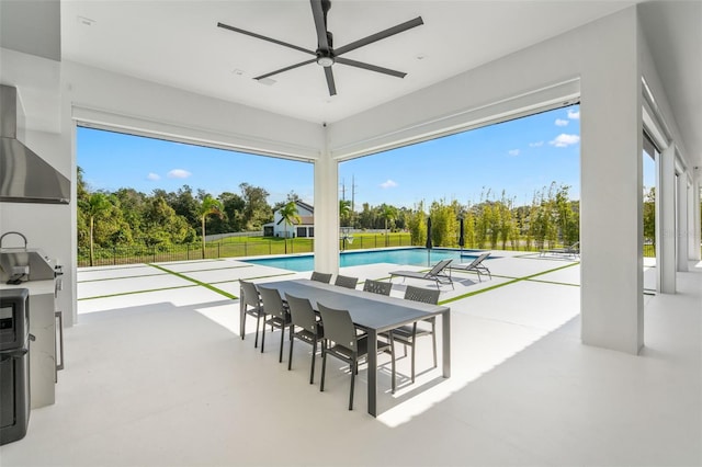 interior space with ceiling fan