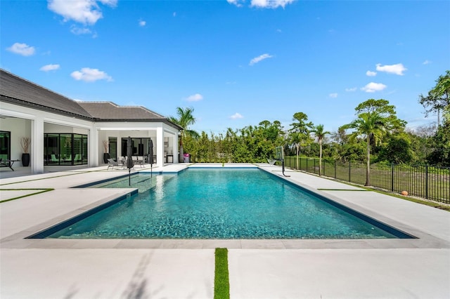 view of swimming pool with a patio area