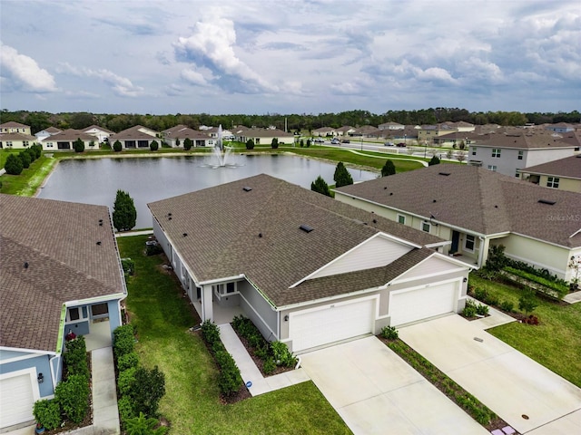 birds eye view of property featuring a residential view and a water view