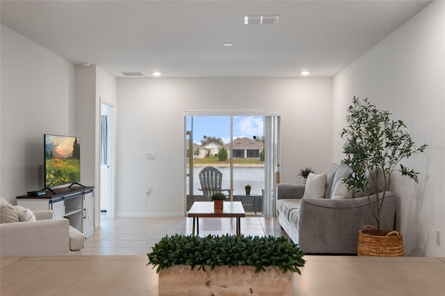 living room with recessed lighting, visible vents, and baseboards