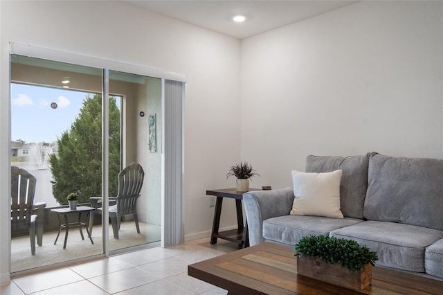 sitting room featuring light tile patterned floors and baseboards