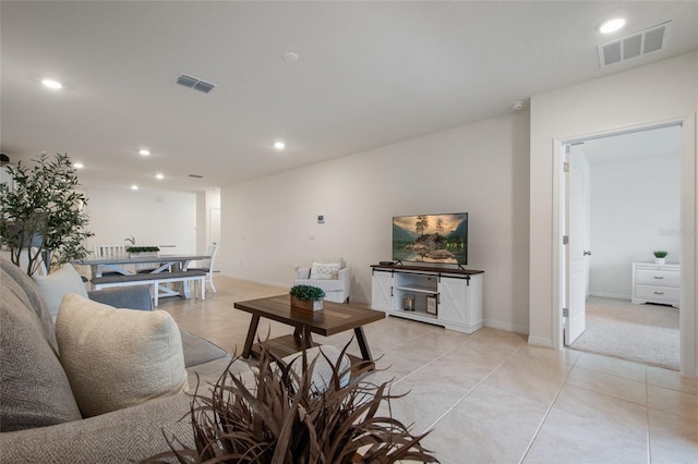 living area featuring recessed lighting and visible vents