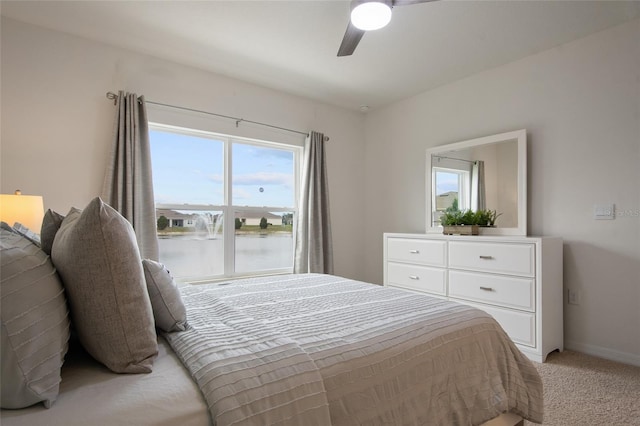 bedroom featuring light carpet, ceiling fan, and baseboards