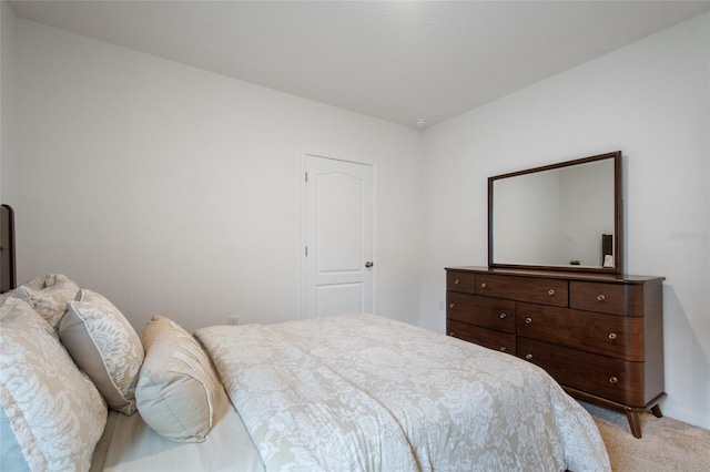 bedroom featuring light colored carpet