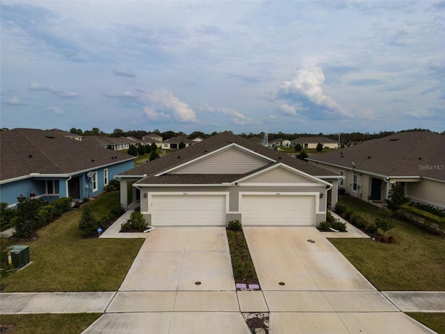 ranch-style house with a garage, concrete driveway, a front lawn, and a residential view