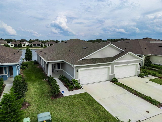 view of front of property featuring a garage, a shingled roof, concrete driveway, a residential view, and a front yard