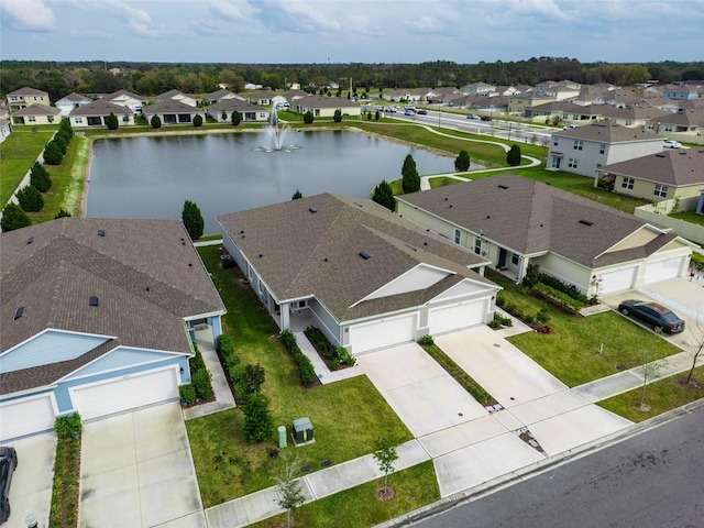 birds eye view of property featuring a residential view and a water view