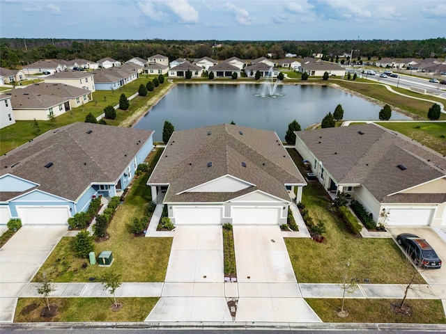 bird's eye view featuring a residential view and a water view