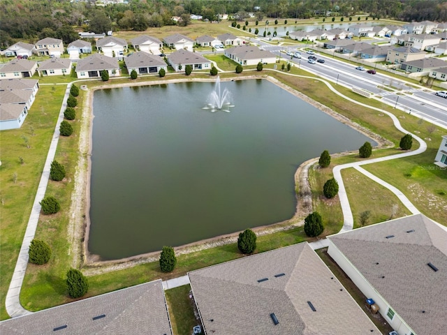 bird's eye view with a water view and a residential view