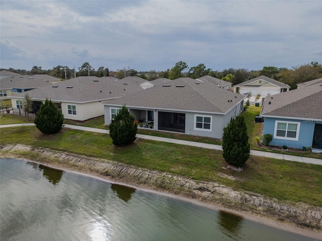 bird's eye view with a residential view and a water view