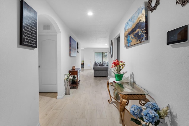 hallway with light wood-type flooring