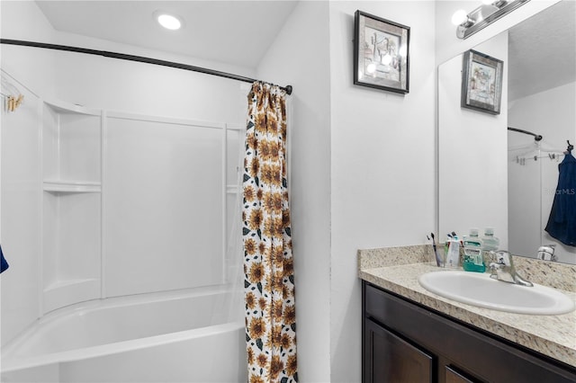 bathroom featuring vanity and shower / bath combination with curtain