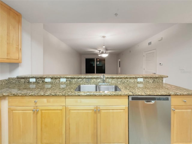 kitchen featuring dishwasher, light stone countertops, sink, and light brown cabinetry